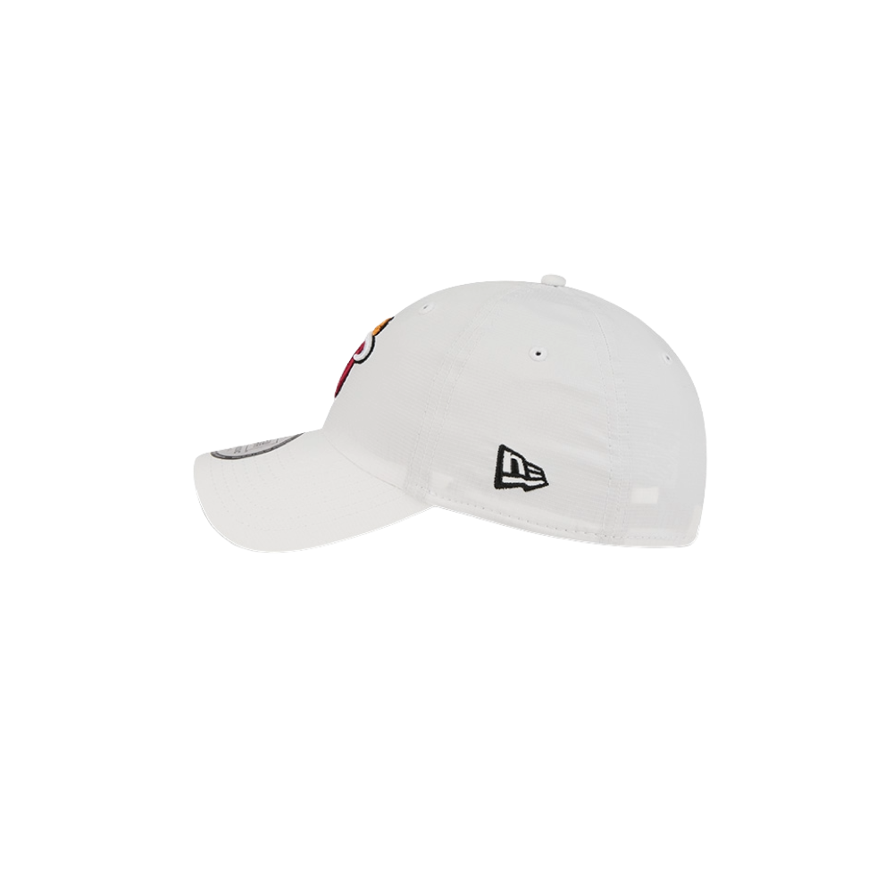 The New Era Miami HEAT Ripstop Dad Hat is a white polyester, one-size hat with a small black New Era logo above the left ear and a partial red and gold embroidered design on the front. Spot clean only.