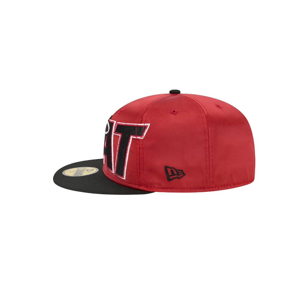 The New Era Miami HEAT Red Satin Fitted Hat features red and black polyester, a flat spandex visor, large embroidered letters on the front and side, and a small black New Era logo on the left. Spot clean to keep it looking fresh.