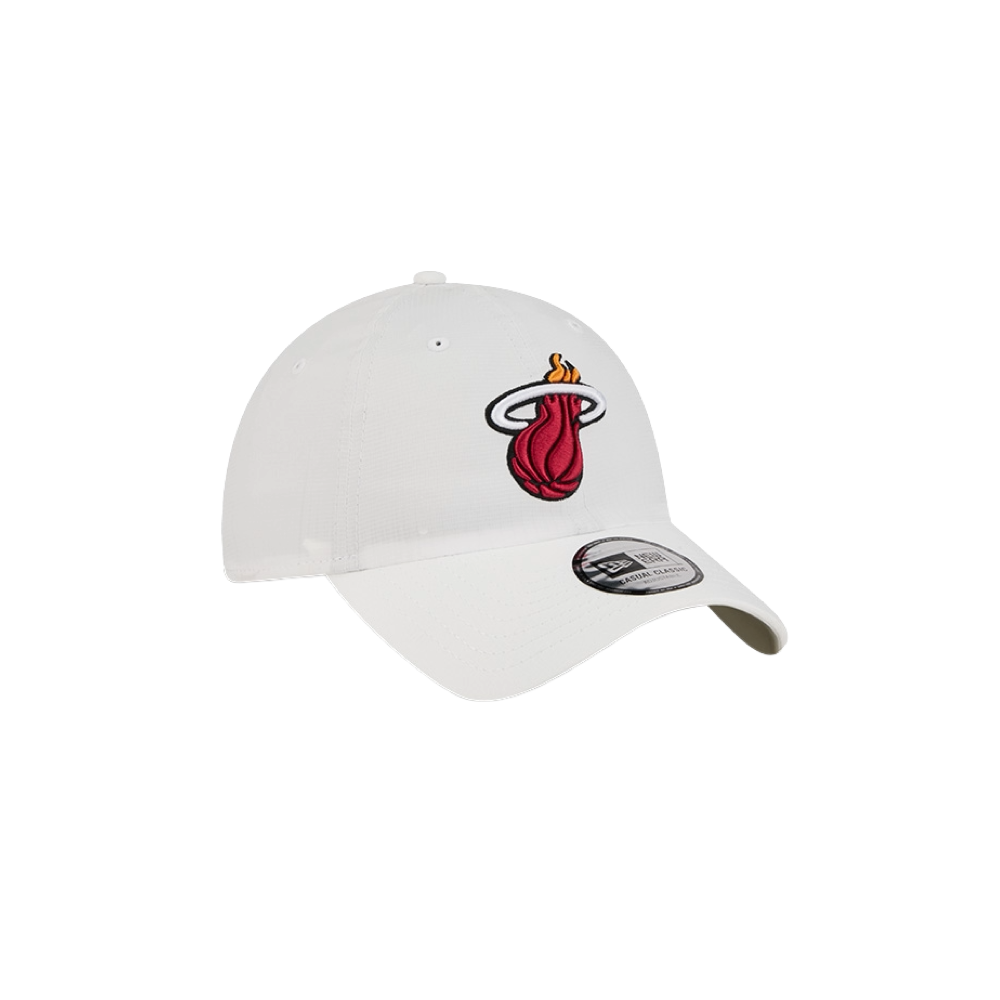 The New Era Miami HEAT Ripstop Dad Hat is a white polyester, one-size hat with a curved brim and the iconic HEAT logo—a red basketball with yellow flame. Features a visor sticker and is easy to spot clean.