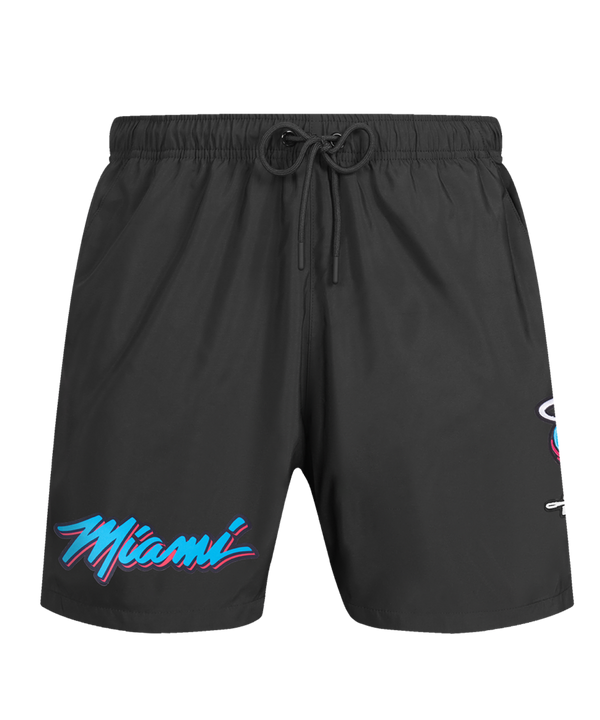 The Pro Standard Miami HEAT Original Vice Nights Woven Shorts feature a drawstring waist, standard fit, “Miami” script in blue and pink on the left leg, a flaming basketball logo on the right, and are machine washable for easy care.