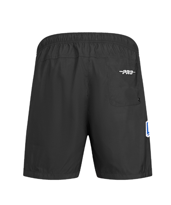The Pro Standard Miami HEAT Original Vice Nights Woven Shorts feature a drawstring waist, standard fit, “Miami” script in blue and pink on the left leg, a flaming basketball logo on the right, and are machine washable for easy care.