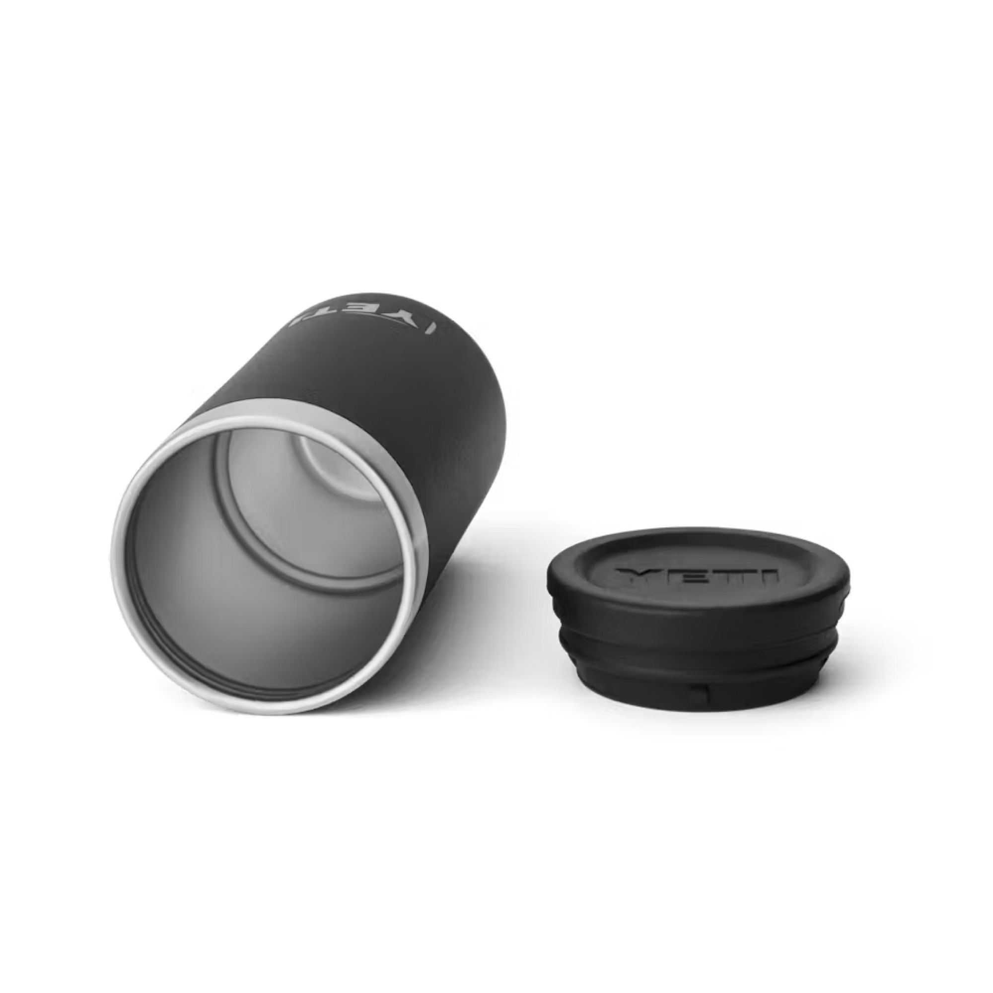 A black Yeti tumbler lies beside its matching lid on a white background, both showing the Yeti logo. Pair with the Yeti Miami HEAT Shot Glass Set for a complete branded drinkware collection.