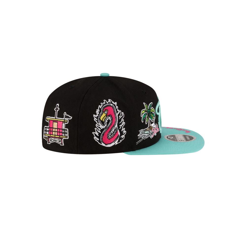 The Court Culture Original Vice Nights Patch Snapback by Court Culture is a black and turquoise polyester hat with side graphics—drum, pink snake, palm tree, and waves—a flat turquoise brim, and an adjustable one-size-fits-most fit.