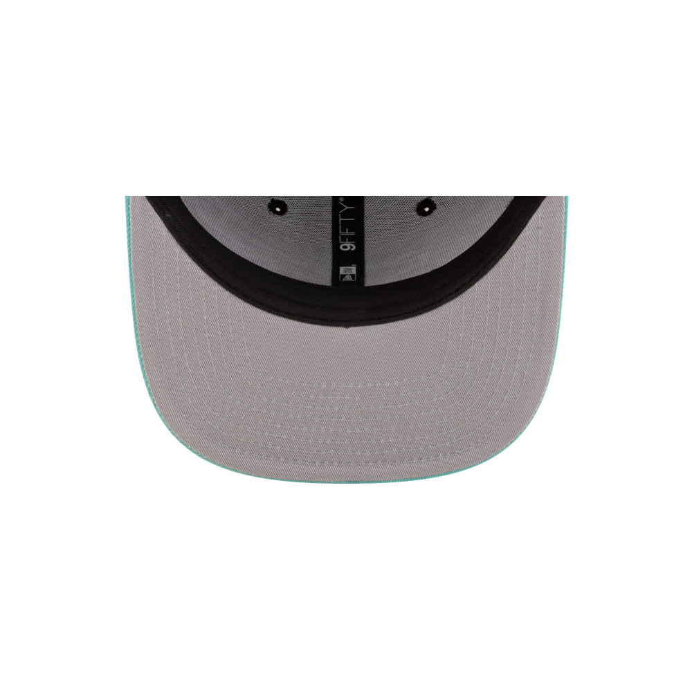 Overhead view of the inside of the Court Culture Original Vice Nights Patch Snapback in gray polyester with a black headband and light turquoise brim trim. Only the underside of the brim and part of the crown are visible. One size fits most.