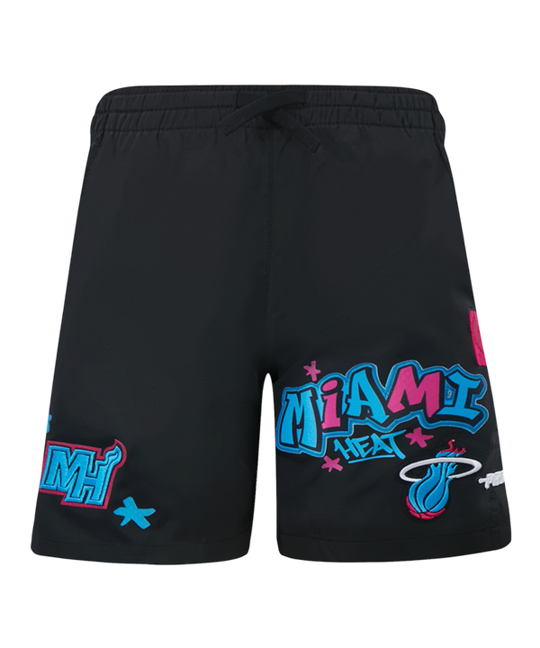 The Pro Standard Miami HEAT Original Vice Nights Youth Shorts feature black polyester fabric with colorful team logo graphics, blue, pink, and white designs, graffiti-style lettering, an elastic drawstring waist, and are machine washable.