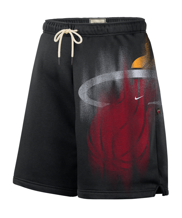 The Nike Miami HEAT Oversized Fleece Logo Shorts feature a black athletic fleece design with a white drawstring and a stylized Miami Heat basketball flame logo in red, orange, and gray on the left leg. Made by Nike in a loose fit with Therma-FIT technology to help keep you warm, these shorts also include a small white Nike Swoosh.