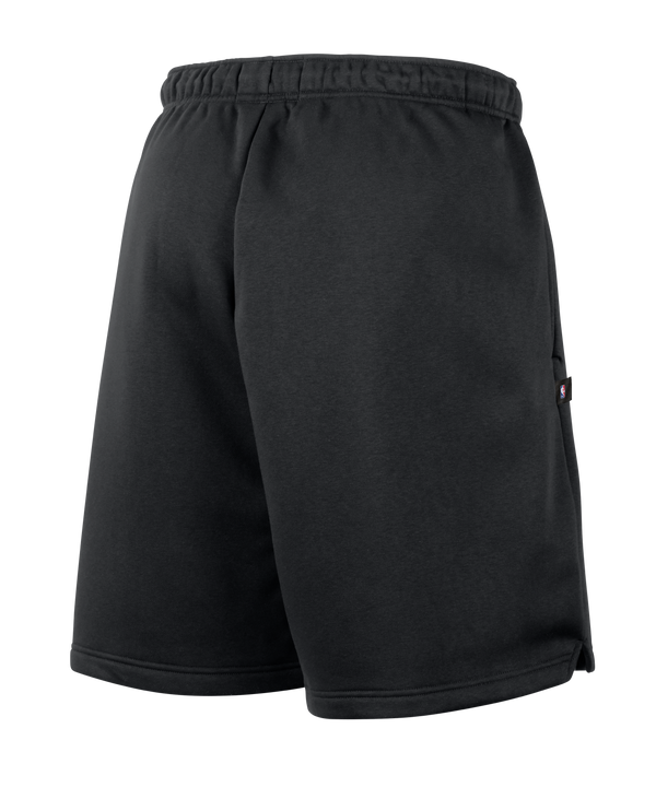 The Nike Miami HEAT Oversized Fleece Logo Shorts feature a black athletic fleece design with a white drawstring and a stylized Miami Heat basketball flame logo in red, orange, and gray on the left leg. Made by Nike in a loose fit with Therma-FIT technology to help keep you warm, these shorts also include a small white Nike Swoosh.