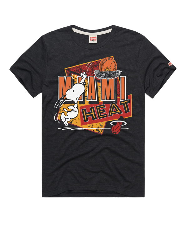 The Homage Miami HEAT Snoopy Tee by Homage is a black T-shirt featuring Snoopy dunking, bold orange and yellow MIAMI HEAT text, a hoop, the Miami Heat logo on the lower right, and made from a soft poly-cotton-rayon blend.