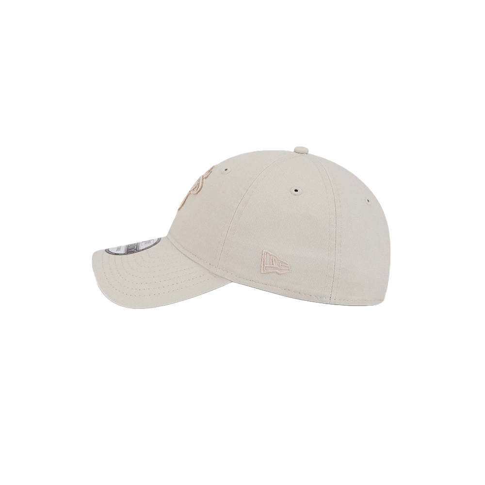 Stone-colored New Era dad hat with curved brim and embroidered side logo.