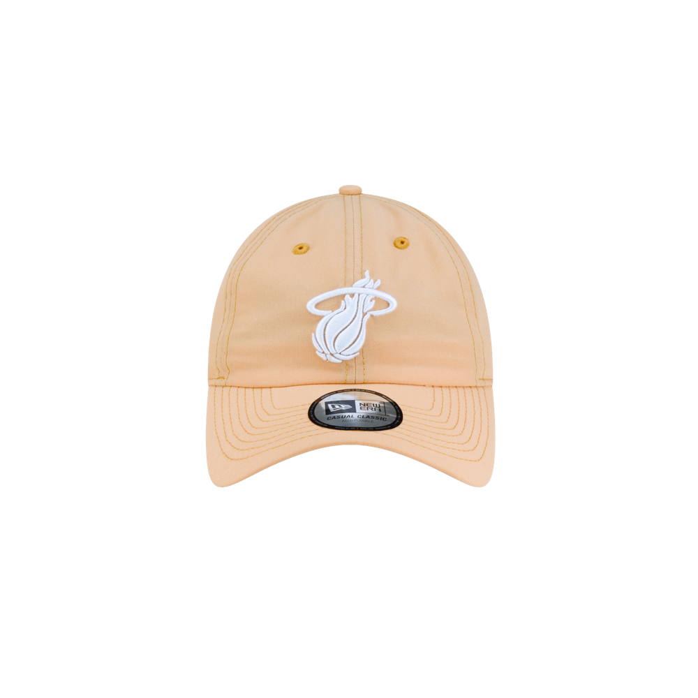 Court Culture x New Era Sandbar Dad Hat in light tan polyester, featuring an embroidered white Miami Heat logo on the front and a black brand sticker on the brim.
