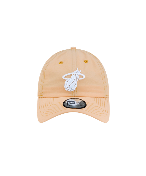Court Culture x New Era Sandbar Dad Cap in light tan polyester featuring a white Miami Heat logo embroidered on the front and a black sticker on the brim.