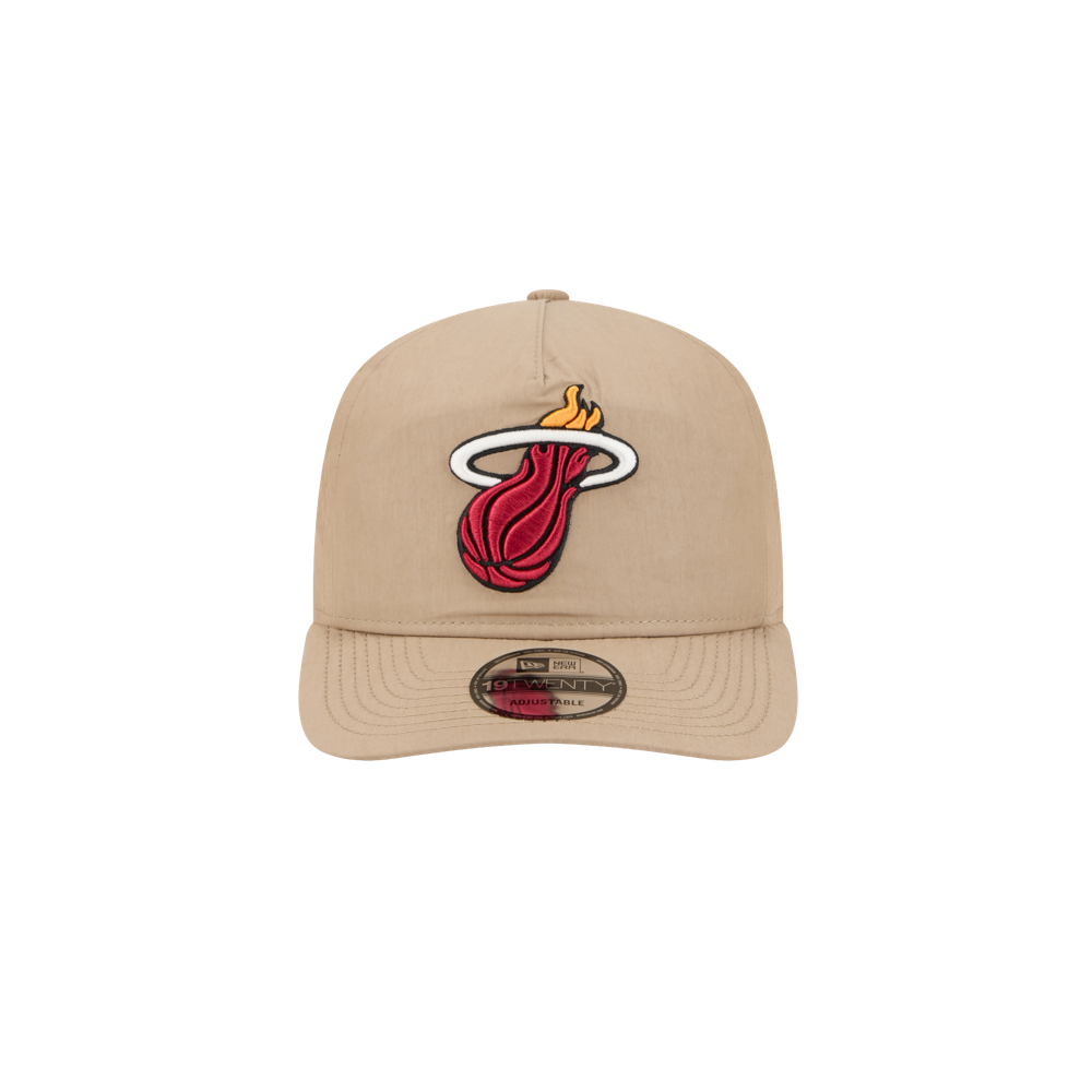 The New Era Miami HEAT Nylon Tan Snapback is a beige cotton-nylon hat with the Miami Heat flaming basketball logo embroidered front, pre-curved visor, bill sticker, and an adjustable fit for most.