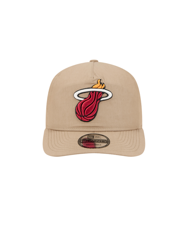 The New Era Miami HEAT Nylon Tan Snapback is a beige cotton-nylon hat with the Miami Heat flaming basketball logo embroidered front, pre-curved visor, bill sticker, and an adjustable fit for most.