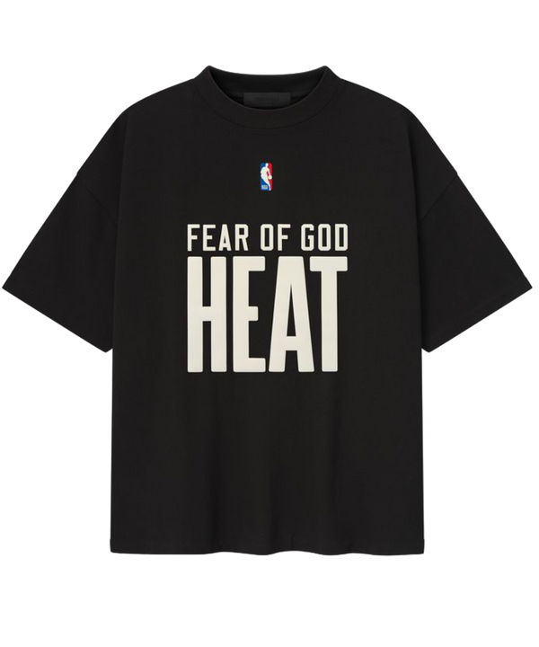 The Essentials Miami HEAT Fear of God Tee by Fear Of God is a black 90s-style oversized cotton jersey featuring the NBA logo and bold white FEAR OF GOD HEAT lettering on the front.