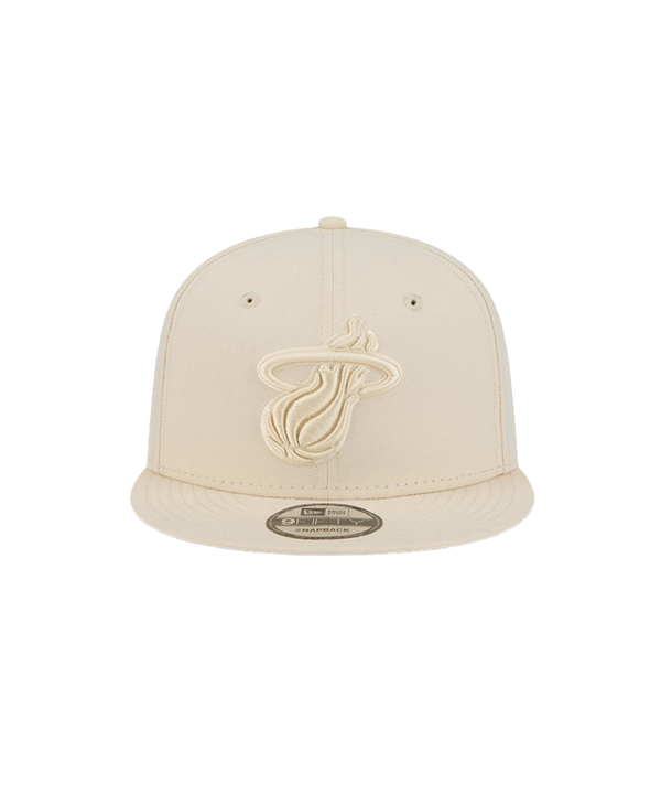 The New Era Miami HEAT Beige Color Pack Snapback features a beige polyester build with the team logo embroidered in matching beige on the front. One size fits most. Product is shown against a plain white background.