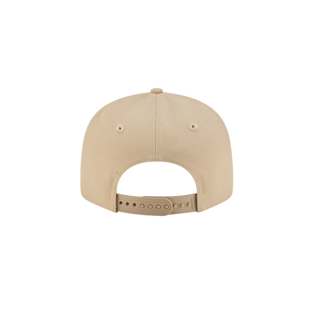 The New Era Miami HEAT Tan Youth Snapback is a beige polyester cap shown from the back, with an adjustable snapback strap, two ventilation holes near the top, and a plain white background. One size fits most and it's easy to spot clean.
