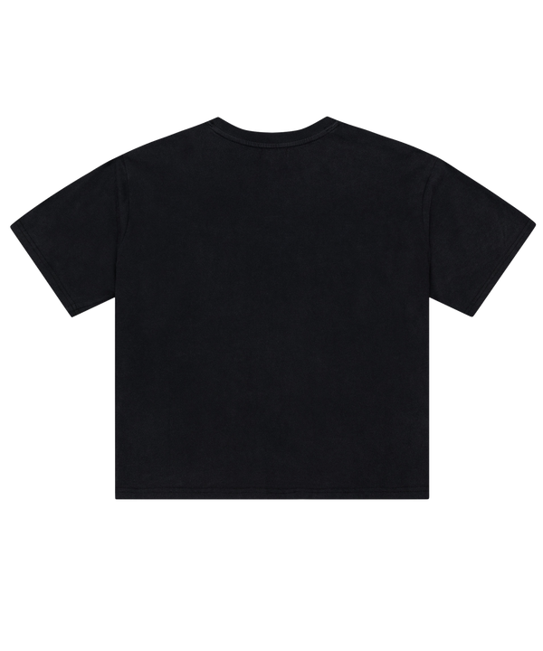 The Mitchell & Ness Miami HEAT Core Logo Women’s Crop Tee is a black, short-sleeve cotton t-shirt with a relaxed fit and cropped length. It features a small Miami Heat logo alongside “Miami” text on the chest and a white rectangular patch near the bottom hem on the left side. This easy-care tee can be simply machine washed and worn.