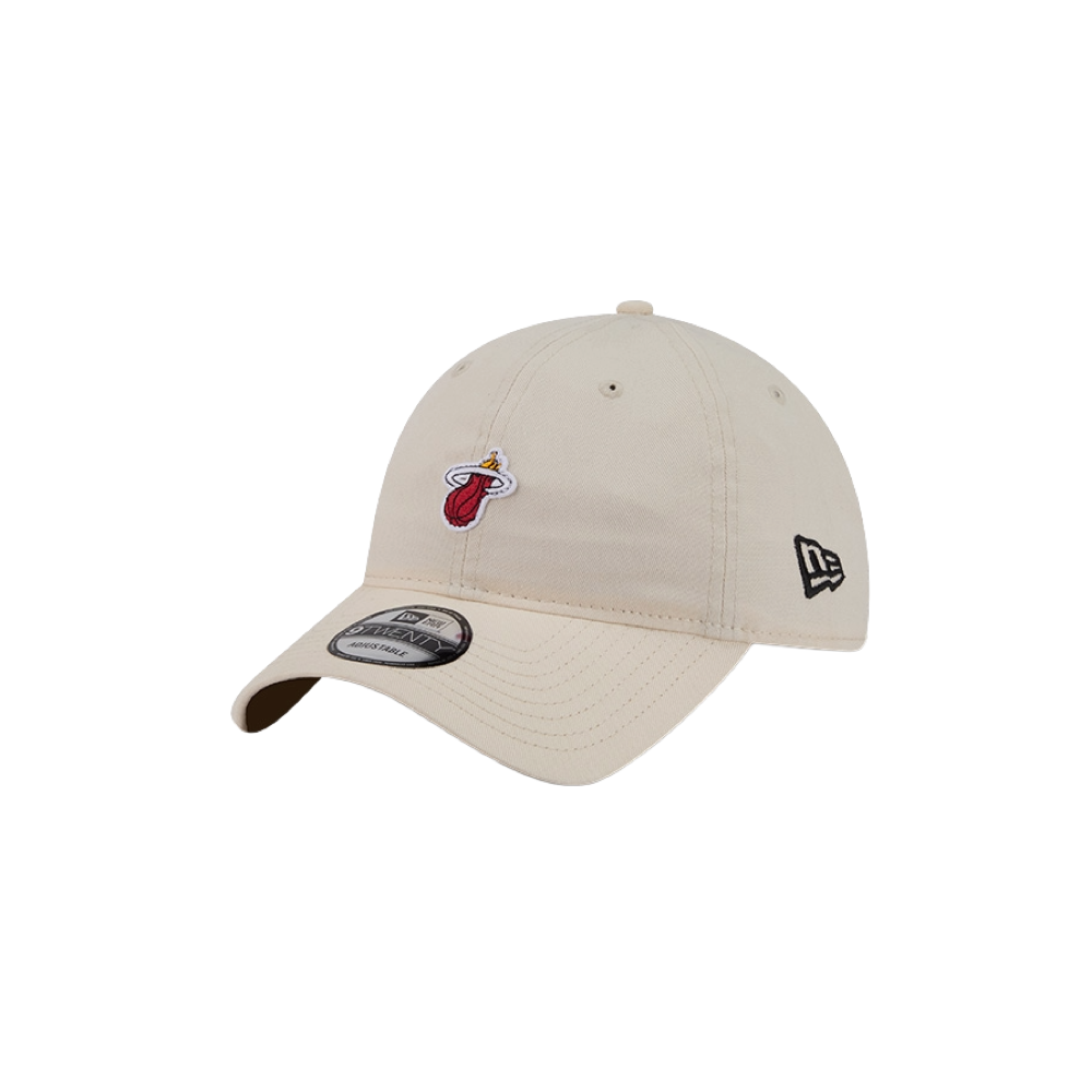 The New Era Miami HEAT Micro Logo Dad Hat is a beige cotton cap with the Miami Heat logo on the front and New Era logo on the side. One size fits most; spot clean for best care. Displayed on a plain white background.