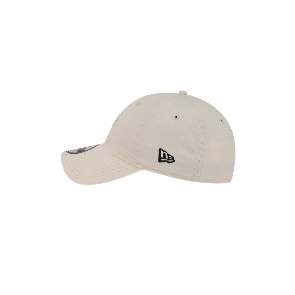 The New Era Miami HEAT Micro Logo Dad Hat is a light beige cotton baseball cap with a small black embroidered logo on the back, visible crown and brim stitching, and a side view. One size fits most; spot clean only.