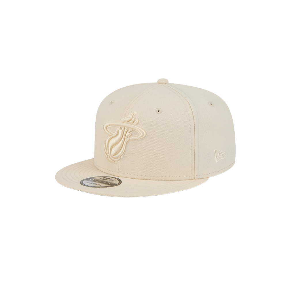The New Era Miami HEAT Beige Color Pack Snapback features an embroidered team logo on the front, a durable polyester build, and an adjustable fit. Shown on a plain white background.