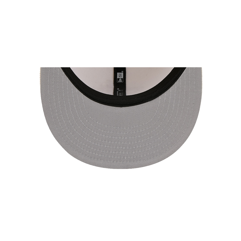 A top-down view of the underside of a New Era Miami HEAT Beige Color Pack Snapback, a flat-brimmed polyester cap with a black inner band and visible stitching. Spot clean only. One size fits most.