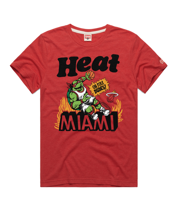 The Homage Miami HEAT Red TMNT Tee by Homage is a standard fit, polyester-cotton-rayon blend featuring a green mascot spinning a basketball with 