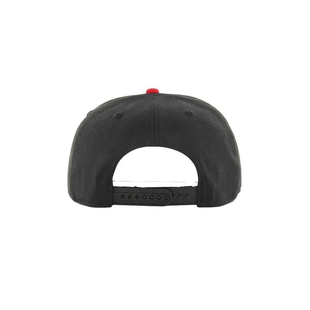 Black snapback cap with adjustable strap and red button on top, rear view.