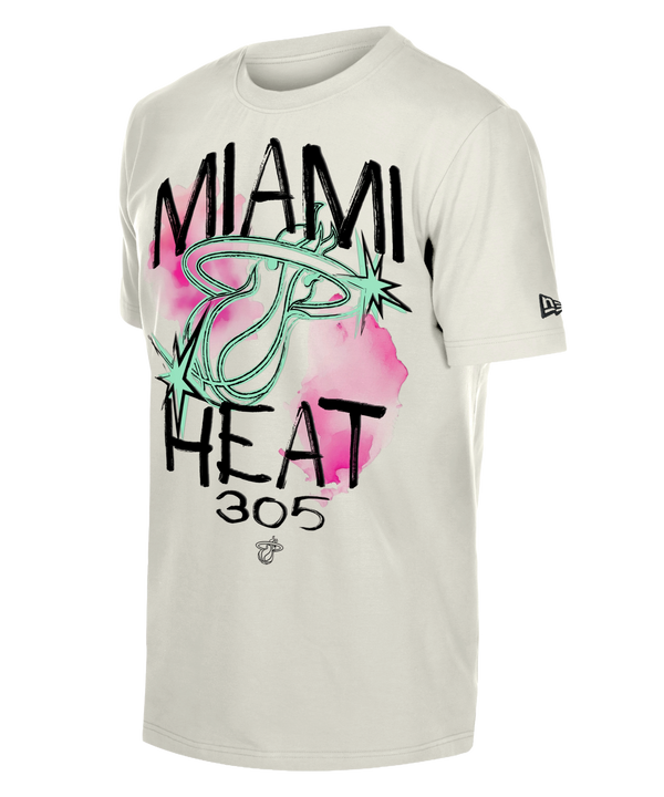 The New Era Miami HEAT 305 Punk Core Tee is a white cotton t-shirt with a neon green flaming basketball and pink brushstroke Miami Heat 305 graphic, standard fit, machine washable, and features the New Era logo on the left sleeve.