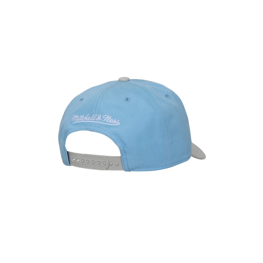 The Mitchell & Ness Miami HEAT Blue Logo Snapback features a light blue design with a gray adjustable snapback, white Mitchell & Ness embroidery on the back, and is displayed against a white background. One size for a perfect fit.
