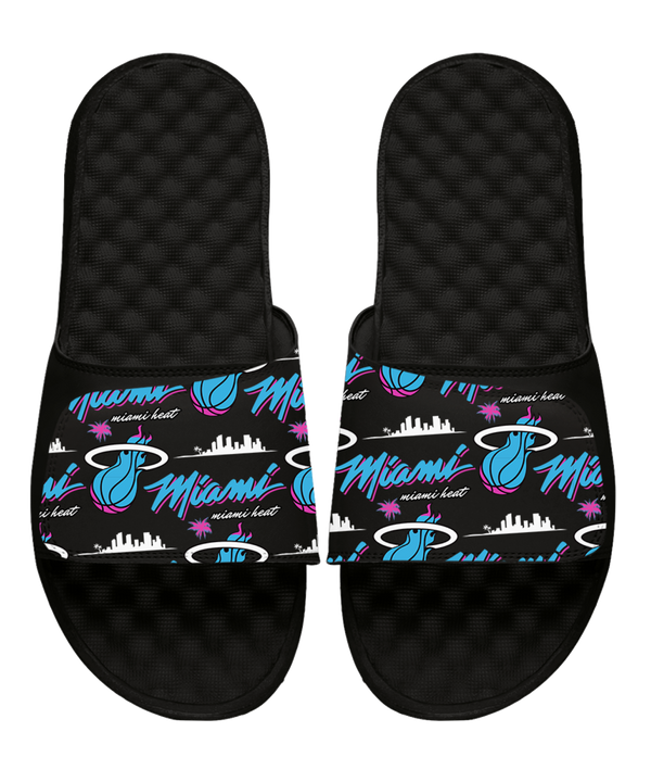 The ISlide Miami HEAT Original Vice Nights Pattern Sandals feature adjustable black straps with vibrant Miami HEAT graphics—including the logo, “Miami,” and a pink, blue, & white city skyline—perfect for comfortable recovery.