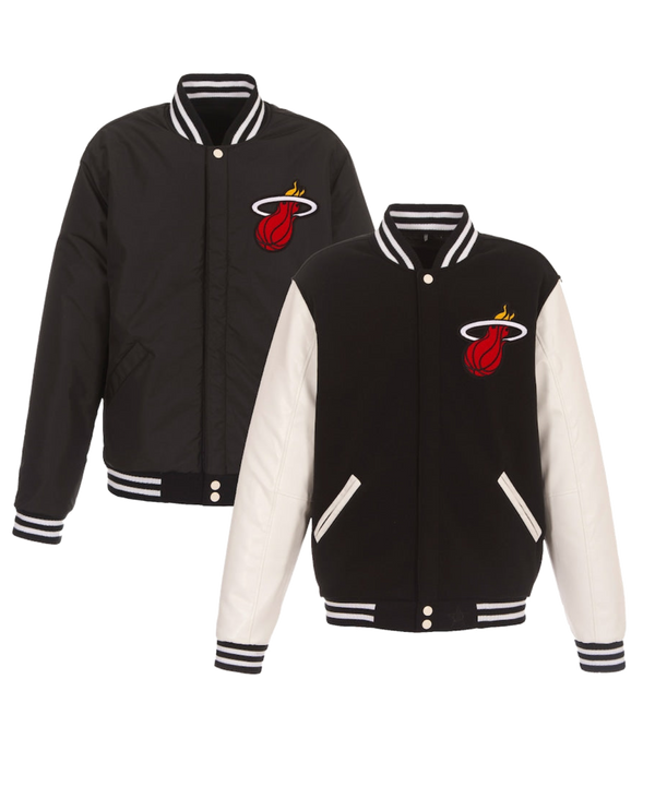 Two black JH Designs Miami HEAT Reversible Varsity Jackets with white-striped collars/cuffs, embroidered red basketball in white flaming hoop logo. One jacket has faux leather sleeves, the other features black sleeves.