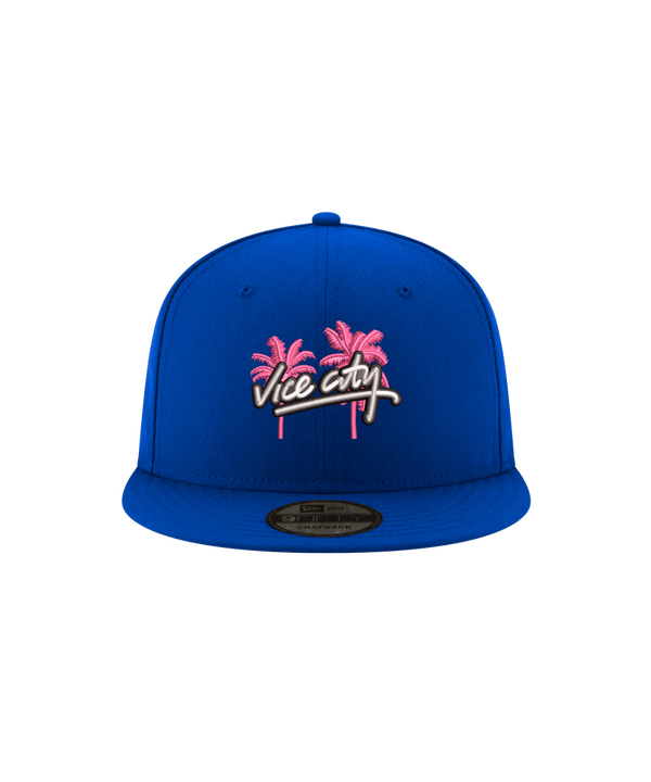 Court Culture x New Era Vice City snapback in blue 100% polyester, featuring an embroidered design of two pink palm trees above the words Vice City in white script.