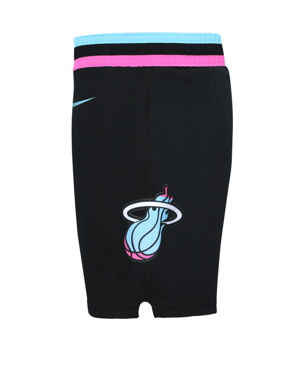 The Nike Miami HEAT Original Vice Nights Kids Replica Shorts feature black polyester with pink and blue trim, NBA and partial Heat logos, a turquoise waistband, vertical stripe details, and are machine washable.