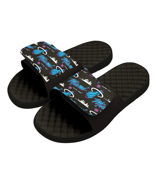 The ISlide Miami HEAT Original Vice Nights Pattern Sandals feature adjustable black straps with vibrant Miami HEAT graphics—including the logo, “Miami,” and a pink, blue, & white city skyline—perfect for comfortable recovery.