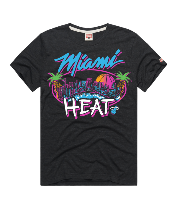 The Homage Miami HEAT Original Vice Nights City Tee by Homage is a black cotton blend shirt with a vibrant graphic of palm trees, basketball, and city skyline featuring bold 