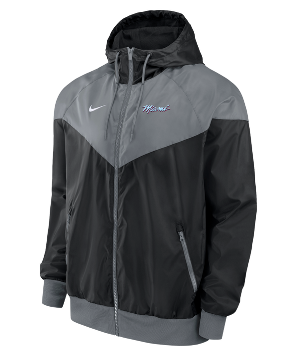 The Nike Miami HEAT Original Vice Nights Windbreaker Jacket is a black and gray polyester hooded jacket with a full front zipper, ribbed cuffs and hem, and 