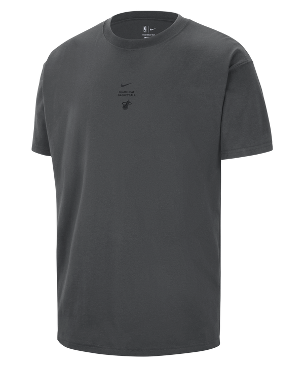 The Nike Miami HEAT 2026-27 Pre-Game Tee is a dark gray, short-sleeve cotton shirt featuring small logos, including the Miami HEAT emblem, on the center chest. This loose fit tee from Nike is displayed on a plain white background.