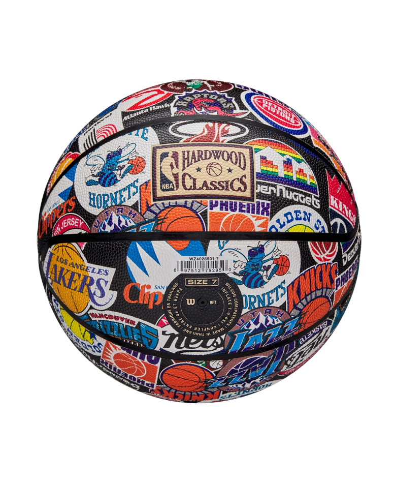 The Wilson All-Team Retro Basketball by Wilson features colorful vintage NBA team logos and patches, plus a Pure Feel Cover for enhanced grip, shown on a white background.