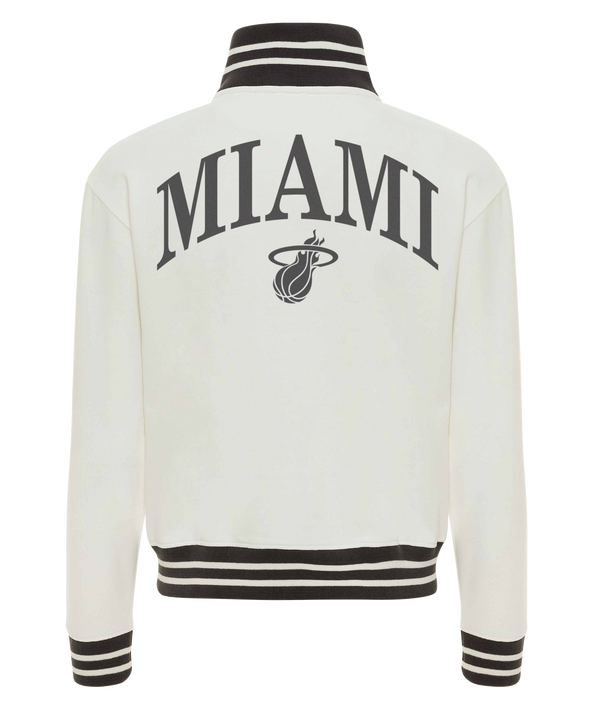 The Sportiqe Miami HEAT Sutton Women's Jacket is a white 100% cotton zip-up with black striped cuffs, collar, and hem. 