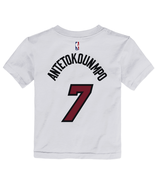 The Giannis Antetokounmpo Nike Association White Name & Number Toddler Tee by Nike features short sleeves and a crisp white color, with Giannis’s number 7 and official team graphics on the front along with a small red Nike swoosh. Made from 100% cotton in a standard fit, this tee is both comfortable and stylish—and easy to care for, thanks to its machine wash cold instructions.