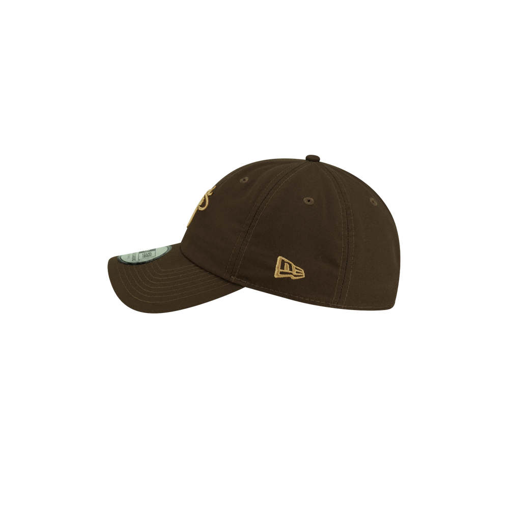 Olive green polyester Court Culture x New Era Olive Dad Hat with an embroidered logo on the front, a team logo on the side, and a circular sticker on the brim.