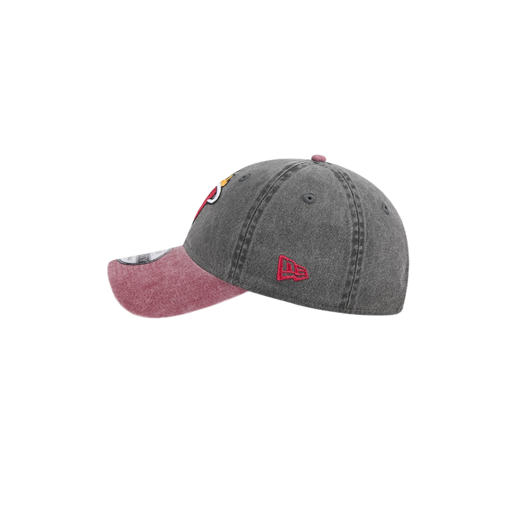 Black washed dad hat with red curved brim, Miami HEAT logo on front, and red New Era logo on side. - New Era Miami HEAT Black Washed Dad Hat