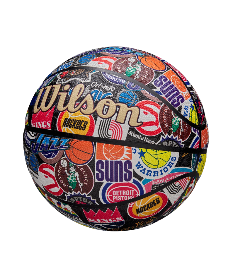 The Wilson All-Team Retro Basketball by Wilson showcases vintage logos of teams like the Suns, Jazz, Celtics, Warriors, Pistons, Rockets, and Hawks on a white background for a classic Pure Feel Cover appearance.
