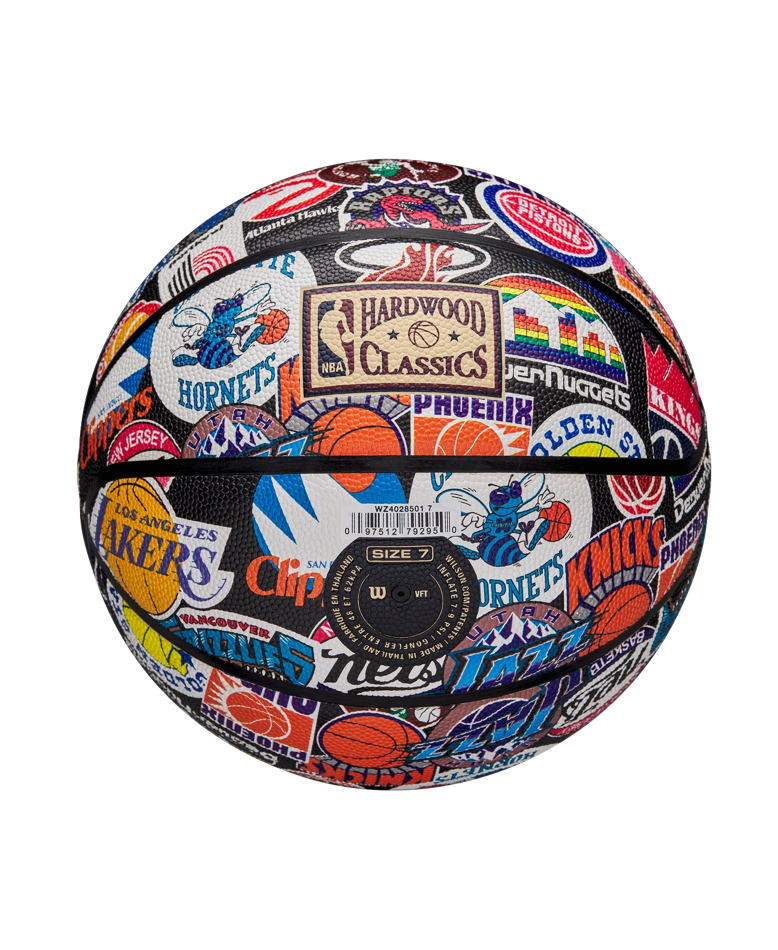 The Wilson All-Team Retro Basketball by Wilson features colorful vintage team logos, including the Lakers, Knicks, Hornets, and Clippers, on a white background with Hardwood Classics designs and a Pure Feel Cover.