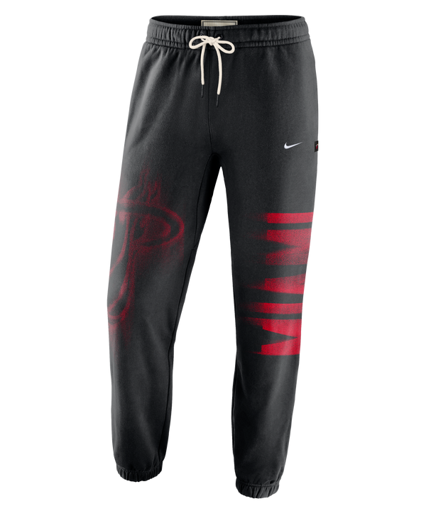Nike Miami HEAT Standard Issue Fleece Pants in black, featuring a white drawstring, a red basketball logo on the right leg, and red MIAMI lettering on the left leg.
