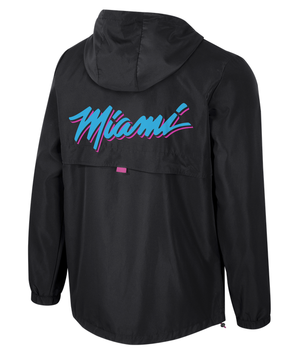 The Stadium Essentials Miami HEAT Original Vice Nights 1/4 Zip Jacket features black fabric with pink accents, a front pouch, and the team’s Vice logo on the left chest. Spot clean to keep this standout Stadium Essentials piece looking sharp.